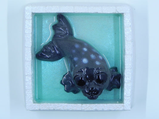 "Seal dark grey in ice pen"