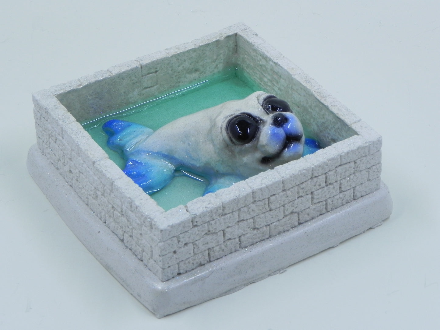 "Seal blue glittered in ice pen"