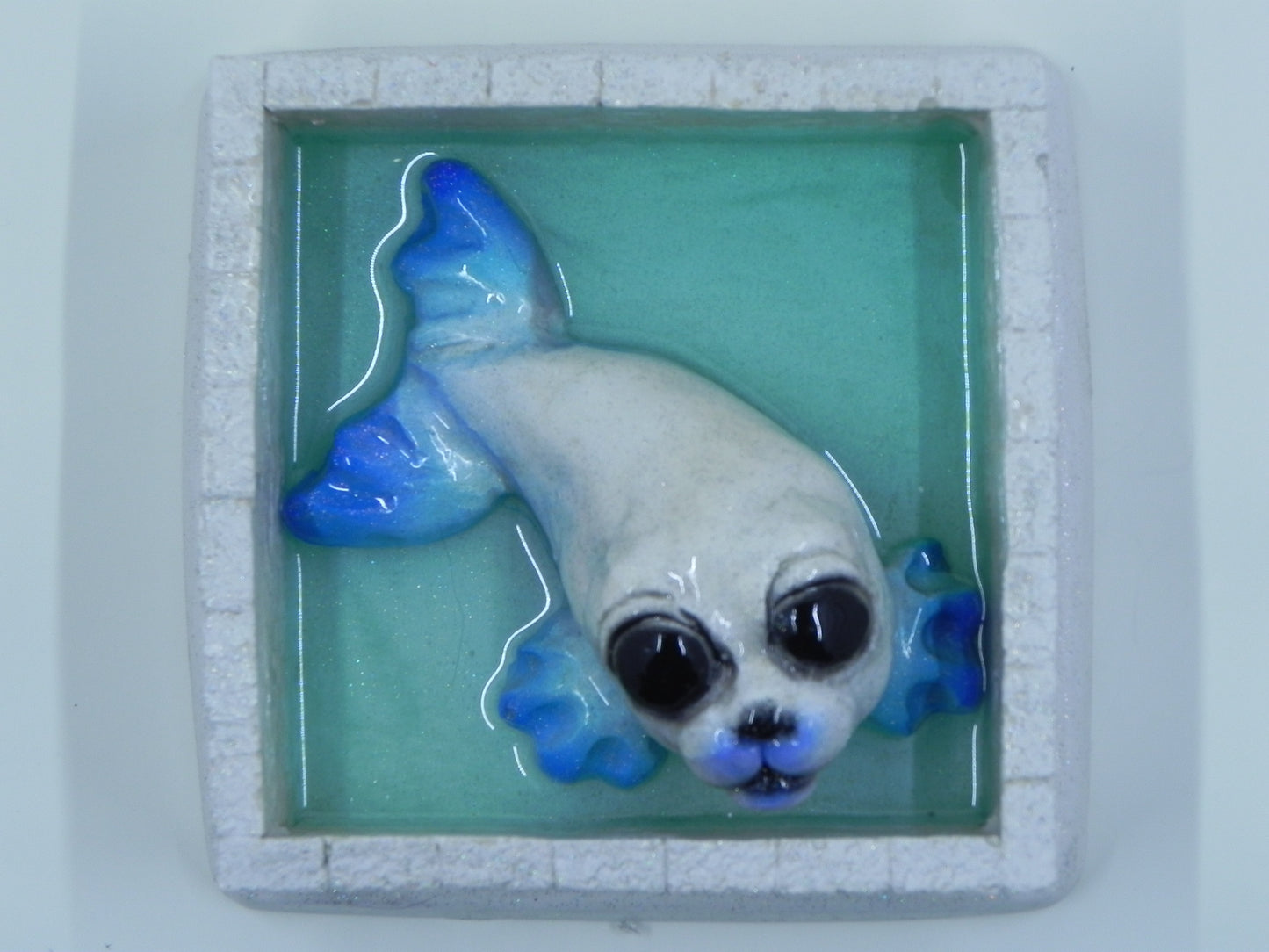 "Seal blue glittered in ice pen"
